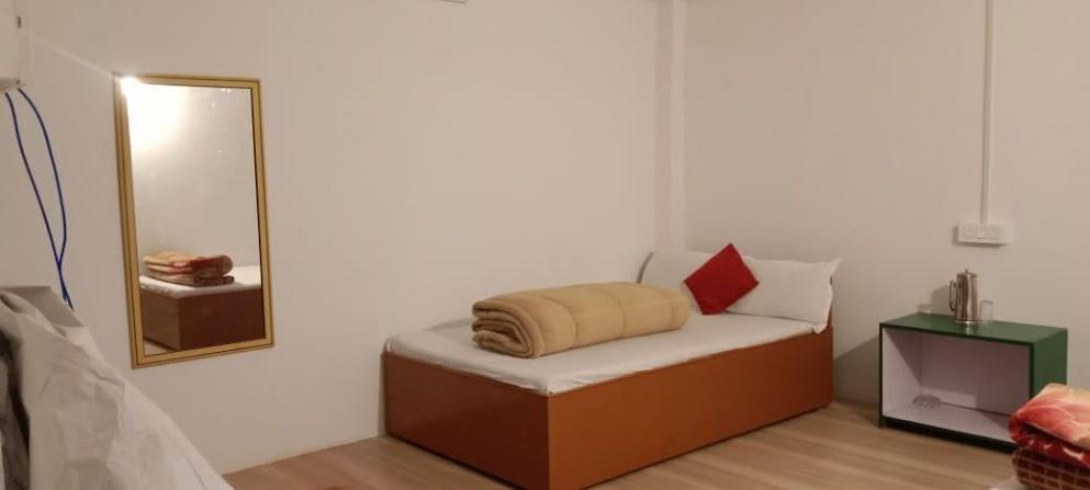 Guest bedroom with a hill view
