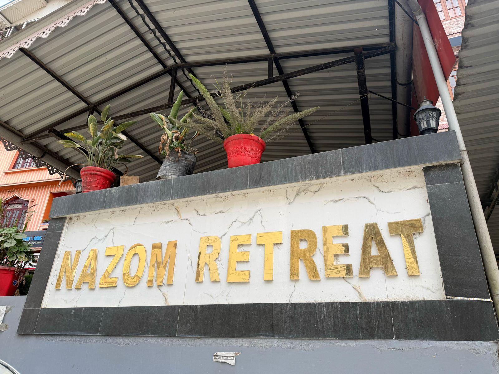 Nazom Retreat entrance signage