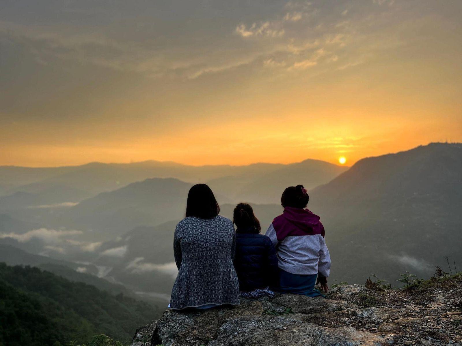 Guests watching the sunset from the property